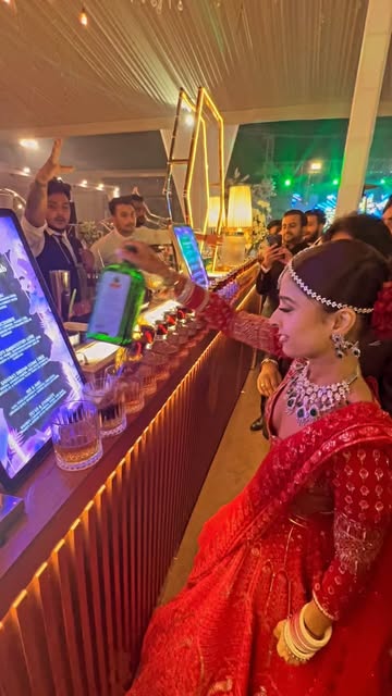 Bride at a long shot-glass domino bar